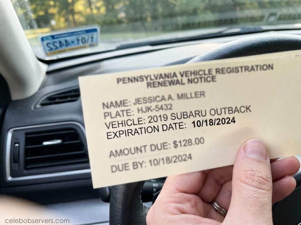 Hand checking the expiration date on a vehicle registration renewal notice